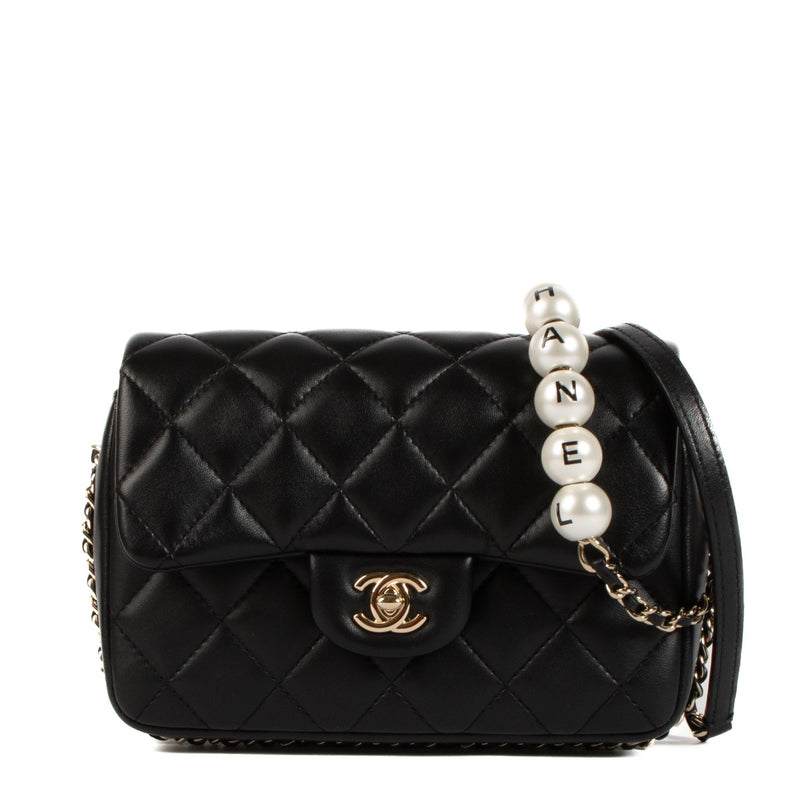 shop 100% authentic second hand Chanel Black Lambskin Logo Pearl Flap Bag on Labellov.com