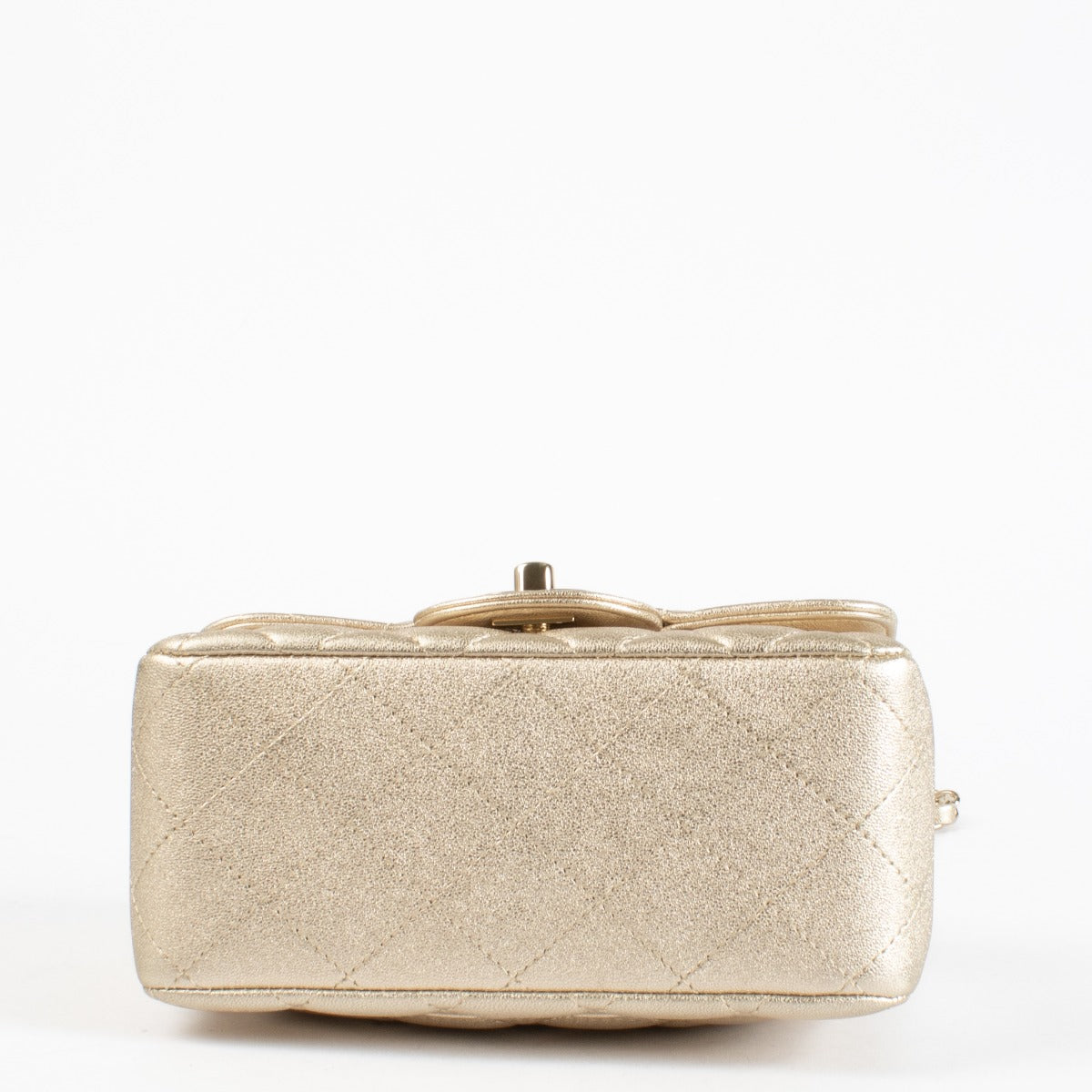 Discover the Chanel Gold Quilted lambskin Square Mini Flap Bag in metallic lambskin with gold hardware timeless, elegant, and in very good pre-loved condition, available at Labellov.com.