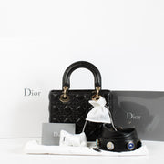 Christian Dior Small Lady Dior Bag in black lambskin with gold hardware and red interior, full set with care booklet and receipt at Labellov.com