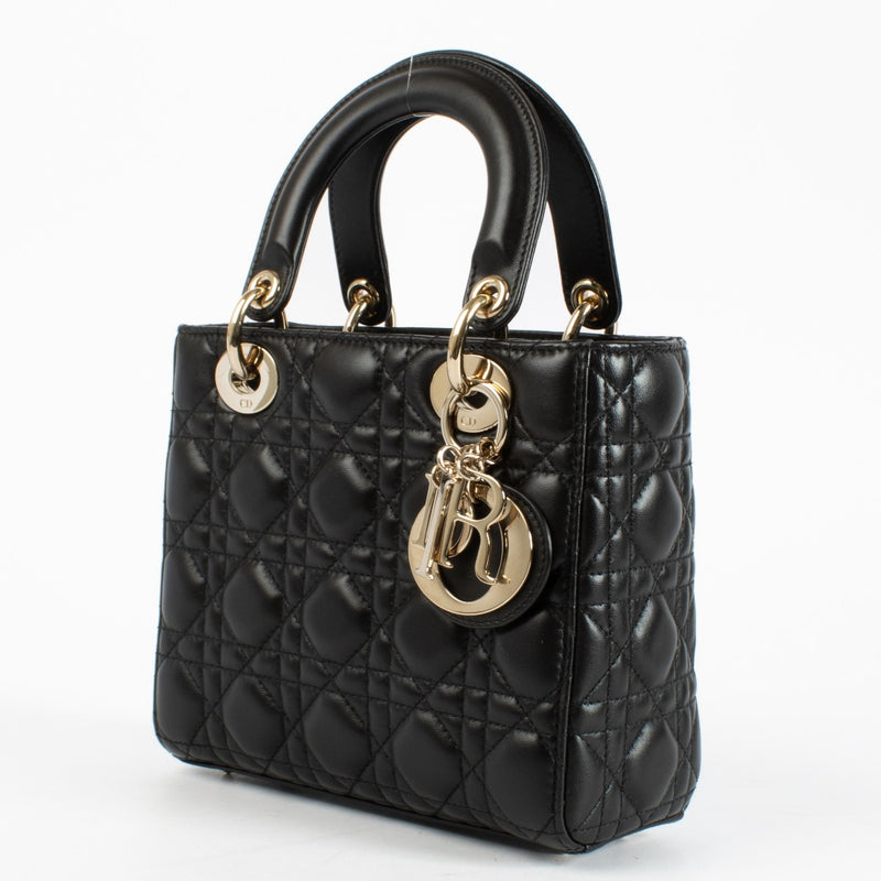 Christian Dior Small Lady Dior Bag in black lambskin with gold hardware and red interior, full set with care booklet and receipt at Labellov.com