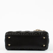 Christian Dior Small Lady Dior Bag in black lambskin with gold hardware and red interior, full set with care booklet and receipt at Labellov.com