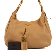 Shop safe online at Labellov in Antwerp, Brussels and Knokke this 100% authentic second hand Prada Beige Daino Leather Shoulder Bag