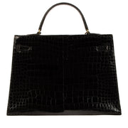 Authentic second hand pre-owned Hermès 1960s-1970s Kelly 35 Black Shiny Porosus Crocodile on labellov.com