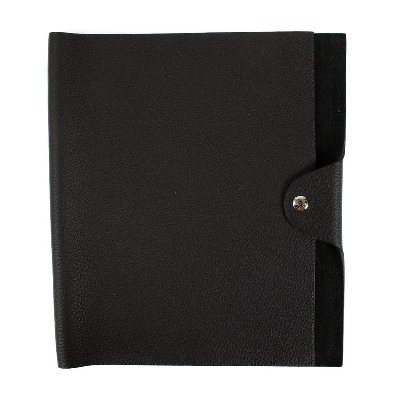 The Hermès Ulysse is a sleek leather notebook holder with a minimalist design, featuring luxurious craftsmanship and a spacious interior for essentials.
