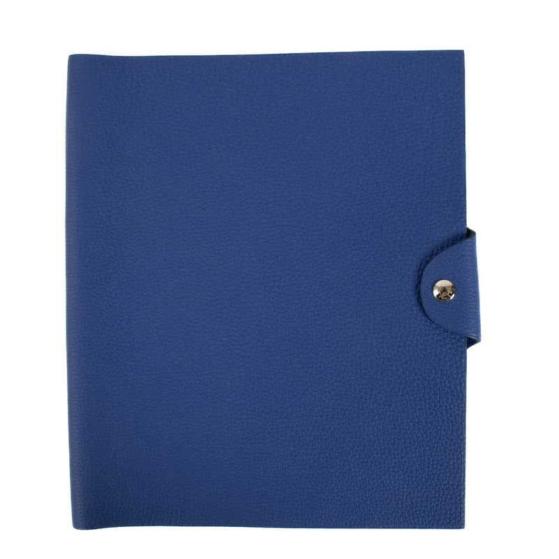The Hermès Ulysse is a sleek leather notebook holder with a minimalist design, featuring luxurious craftsmanship and a spacious interior for essentials. Shop now on Labellov.com.