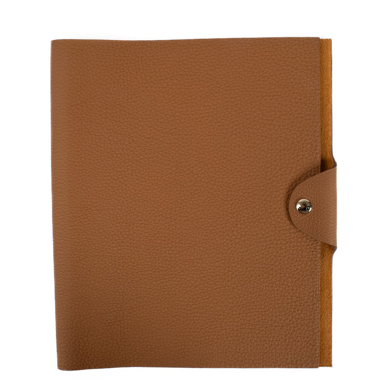 The Hermès Ulysse is a sleek leather notebook holder with a minimalist design, featuring luxurious craftsmanship and a spacious interior for essentials. Shop now on Labellov.com.