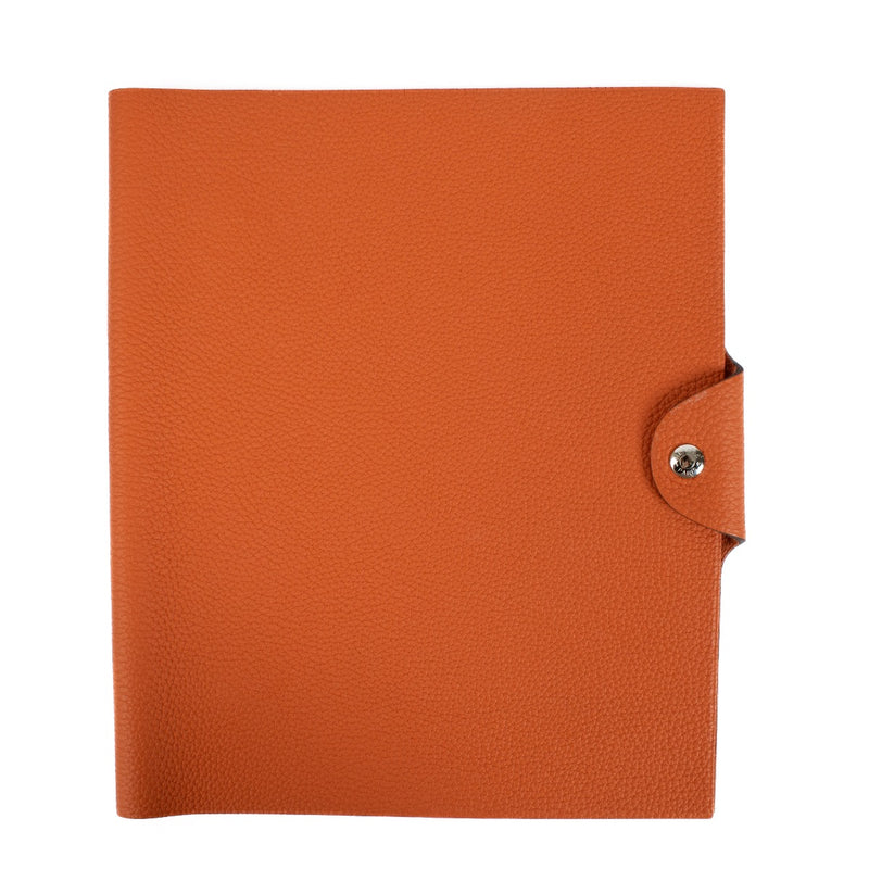 The Hermès Ulysse is a sleek leather notebook holder with a minimalist design, featuring luxurious craftsmanship and a spacious interior for essentials. Shop now on Labellov.com