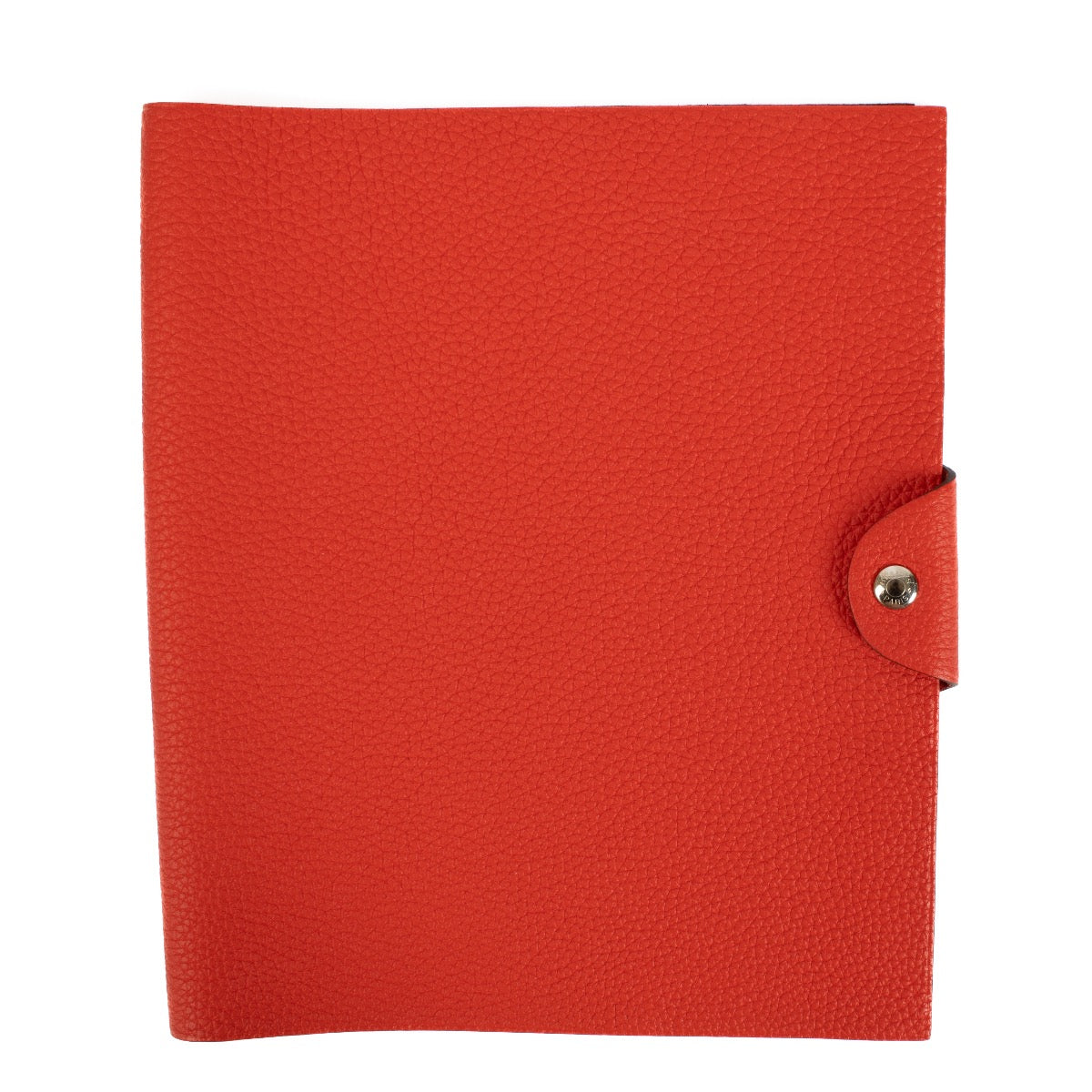 The Hermès Ulysse is a sleek leather notebook holder with a minimalist design, featuring luxurious craftsmanship and a spacious interior for essentials.