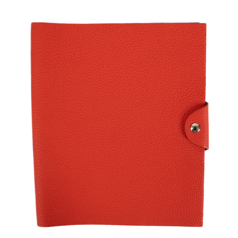 The Hermès Ulysse is a sleek leather notebook holder with a minimalist design, featuring luxurious craftsmanship and a spacious interior for essentials.