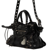 Balenciaga Black Neo Cagole City Bag for the best price at Labellov secondhand luxury in Antwerp, Knokke, Brussels and with worldwide shipping. Buy and sell your preloved and brand new designer bags for the best price online.