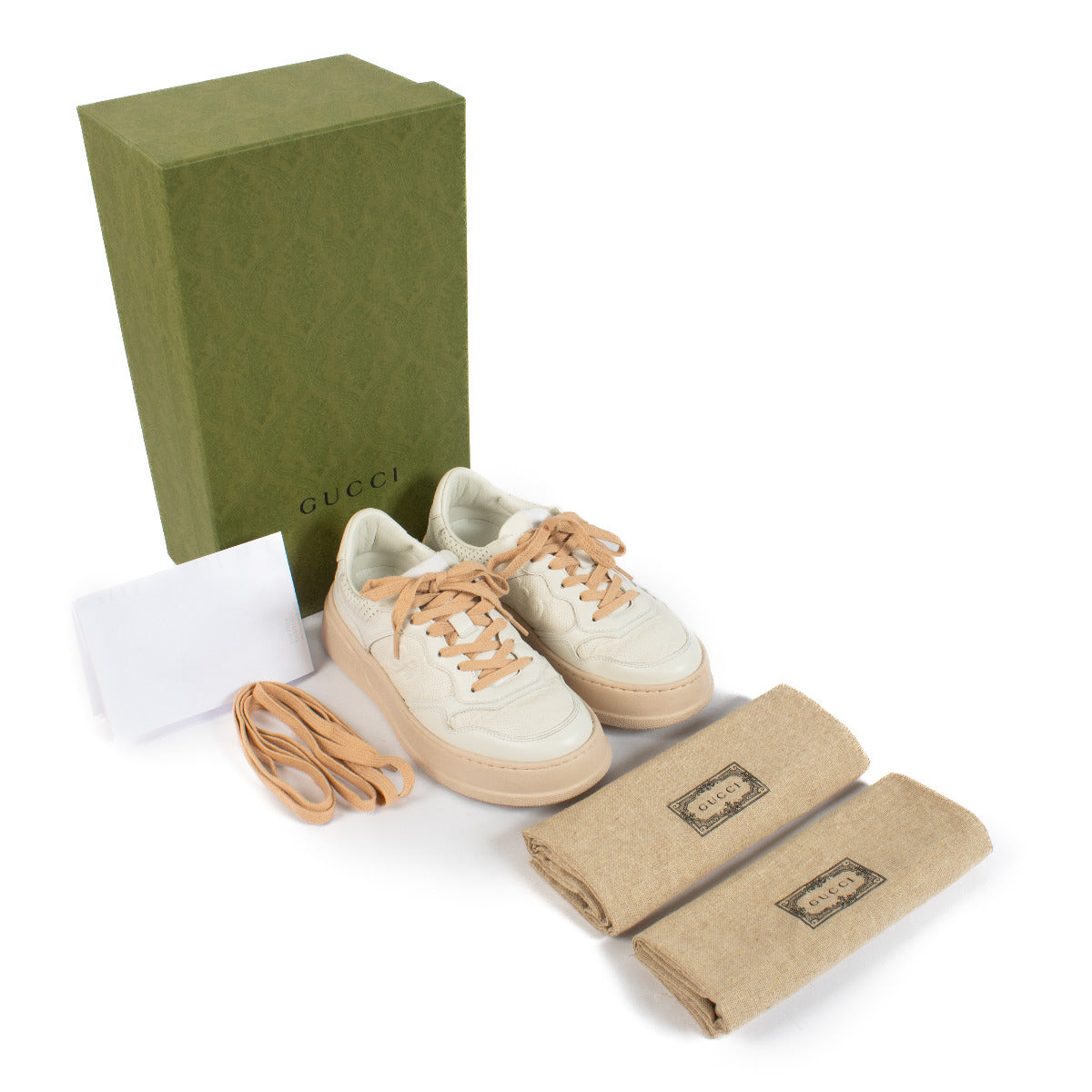 Gucci White GG Embossed Sneakers for sale at Labellov secondhand luxury. We buy and sell your bags.