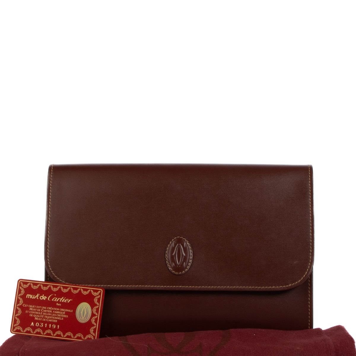 Buy real authentic Must De Cartier Burgundy Leather Clutch safe online at Labellov.com or in Brussels, Knokke and Antwerp