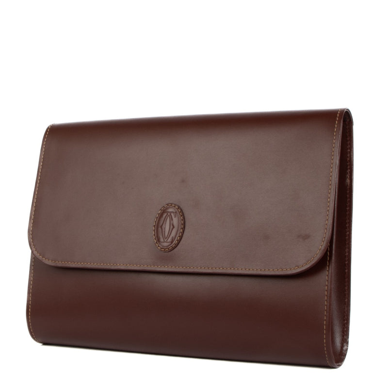Buy real authentic Must De Cartier Burgundy Leather Clutch safe online at Labellov.com or in Brussels, Knokke and Antwerp
