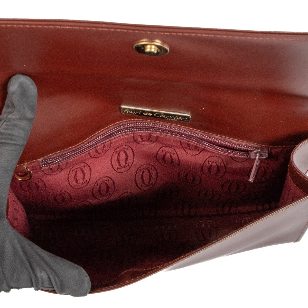Buy real authentic Must De Cartier Burgundy Leather Clutch safe online at Labellov.com or in Brussels, Knokke and Antwerp