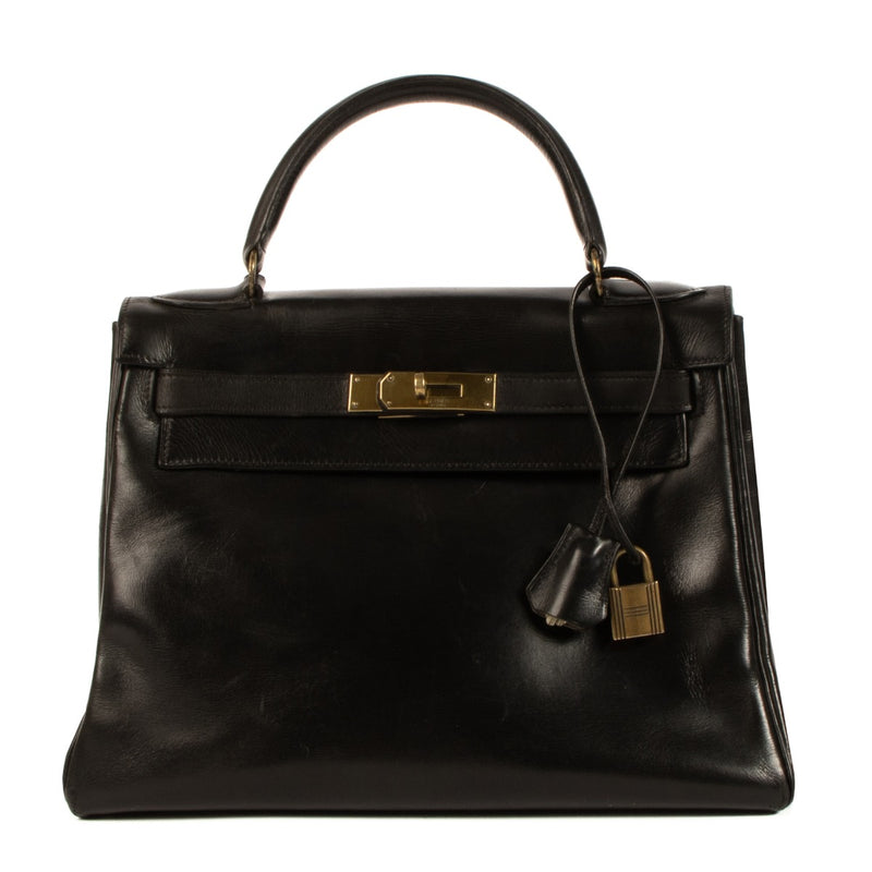 Authentic second hand 1960s Hermès Vintage Kelly 28 Black Box on www.labellov.com