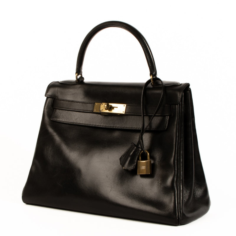 Authentic second hand 1960s Hermès Vintage Kelly 28 Black Box on www.labellov.com