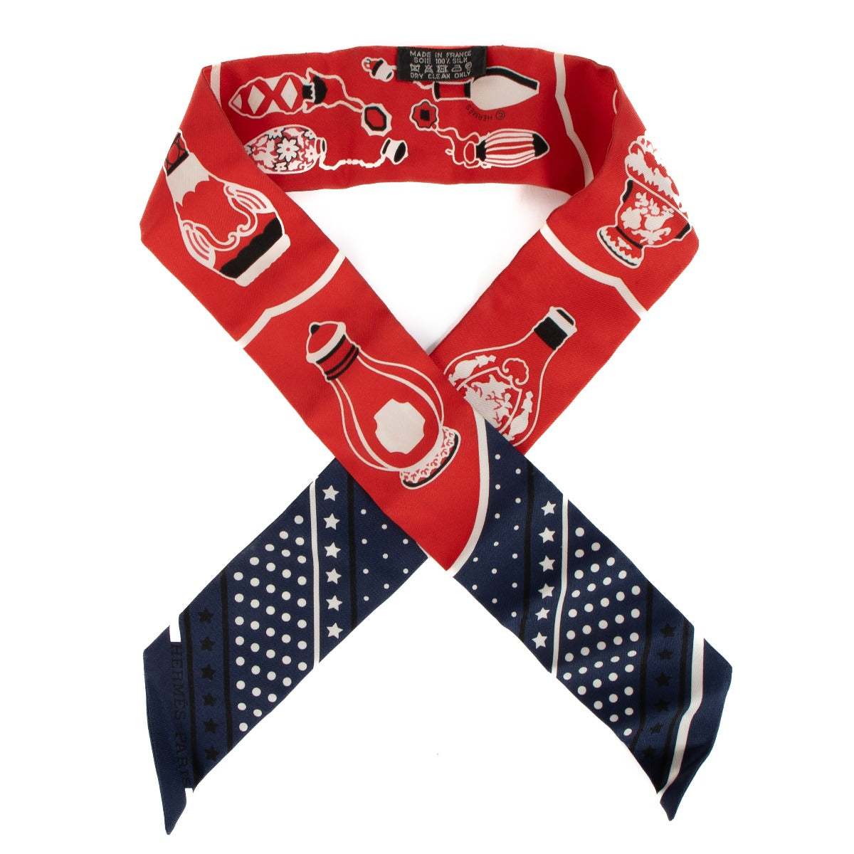 Shop safe online at Labellov in Antwerp, Brussels and Knokke this 100% authentic second hand Hermès Marine / Rouge / Blanc Silk Les Flacons Twilly Scarf