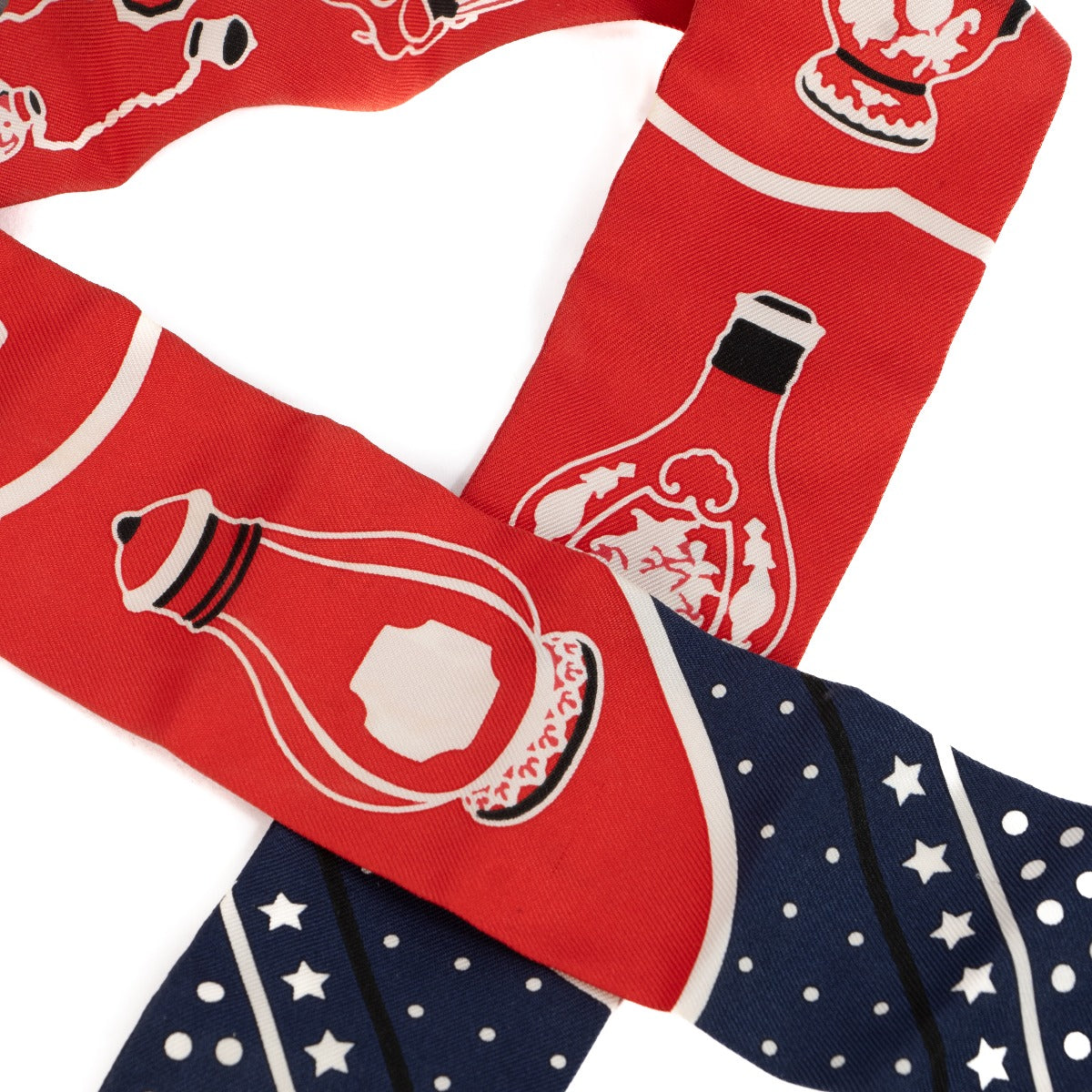 Shop safe online at Labellov in Antwerp, Brussels and Knokke this 100% authentic second hand Hermès Marine / Rouge / Blanc Silk Les Flacons Twilly Scarf