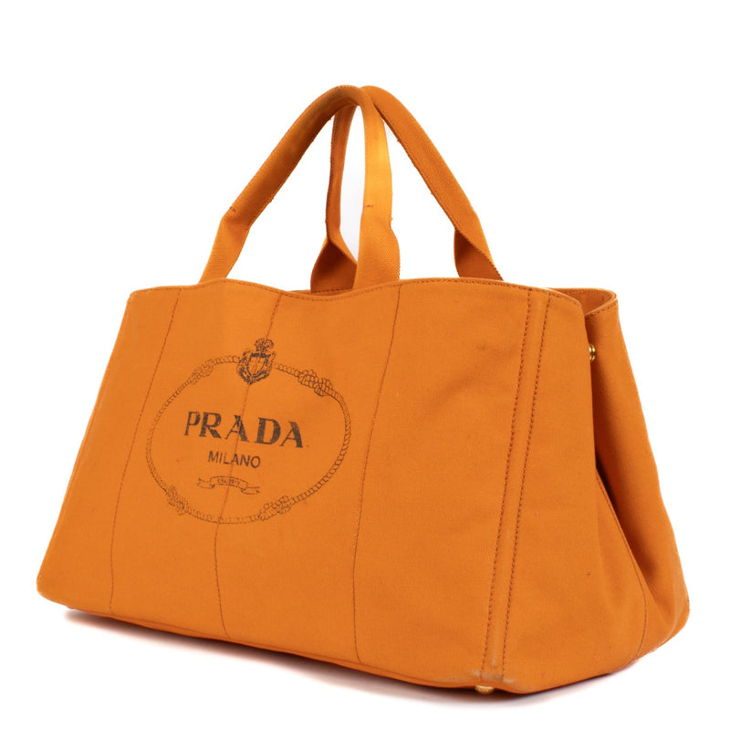 Shop safe online at Labellov in Antwerp, Brussels and Knokke this 100% authentic second hand Prada Orange Canapa Large Top Handle Bag