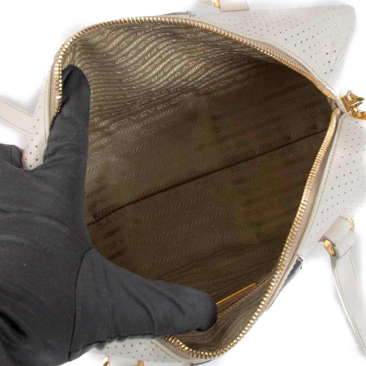 Shop 100% authentic second-hand Prada White/Black Perforated Saffiano Leather Boston Bag on Labellov.com