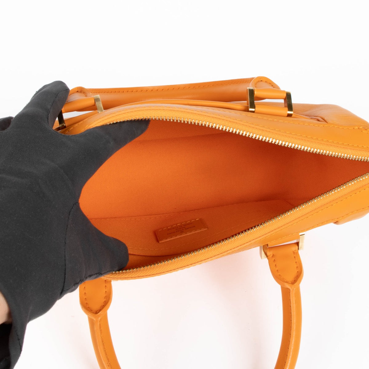Authentic pre-loved Louis Vuitton Orange Epi Dhanura PM Top Handle Bag on Labellov.com