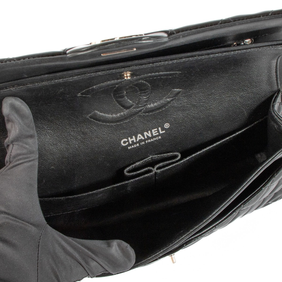 Shop safe online at Labellov in Antwerp, Brussels and Knokke this 100% authentic second hand Chanel Black Patent Leather Medium Classic Flap Bag
