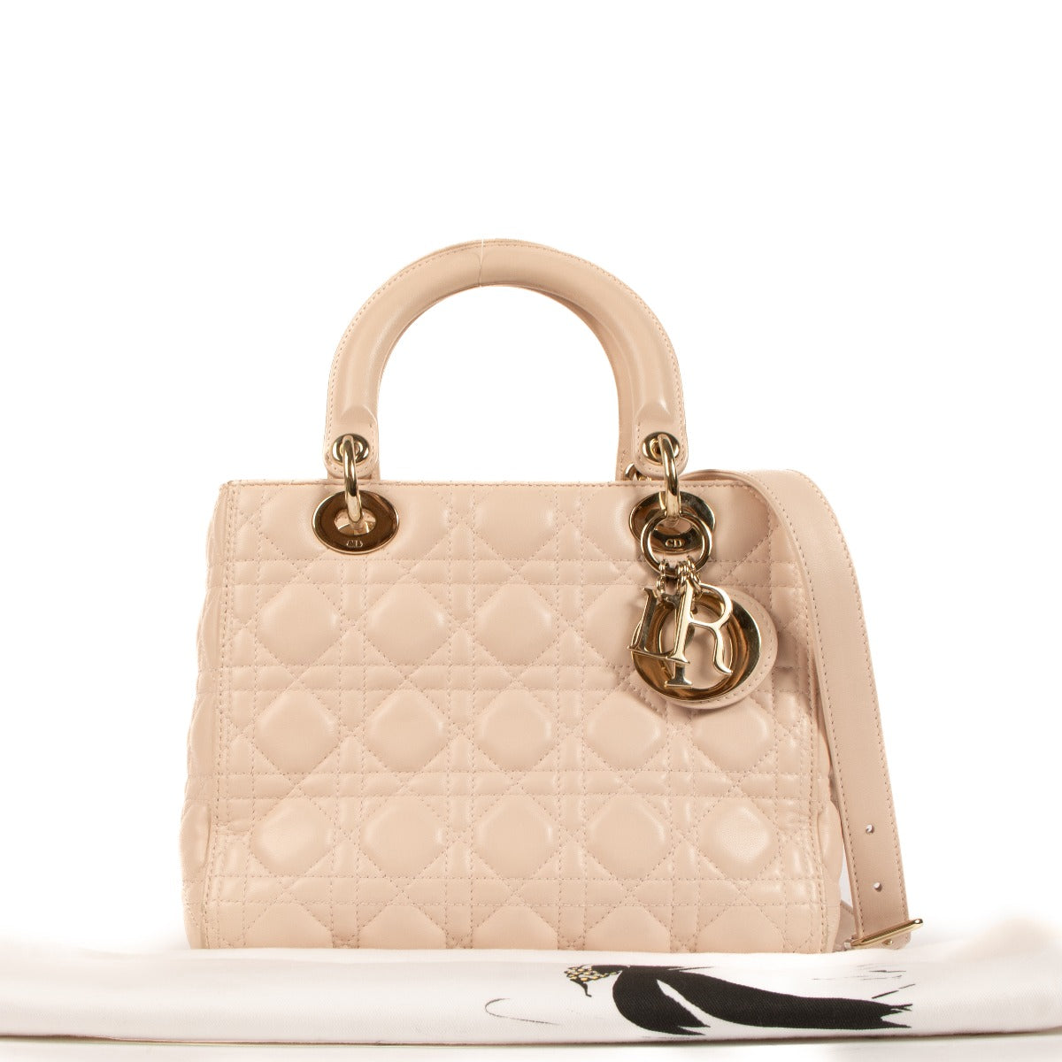 Christian Dior Lady Dior Rose Poudre Fabric Top Handle Bag for the best price at Labellov secondhand luxury in Antwerp. We buy and sell your preloved and new designer bags for the best price at Labellov secondhand luxury in Antwerp. Koop en verkoop uw aut