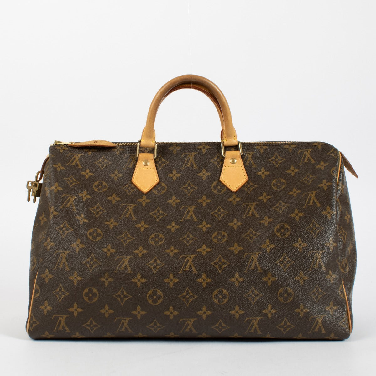 Louis Vuitton Speedy 40 in Monogram canvas with Vachetta leather trim and gold hardware. A timeless Louis Vuitton icon in very good pre-loved condition.