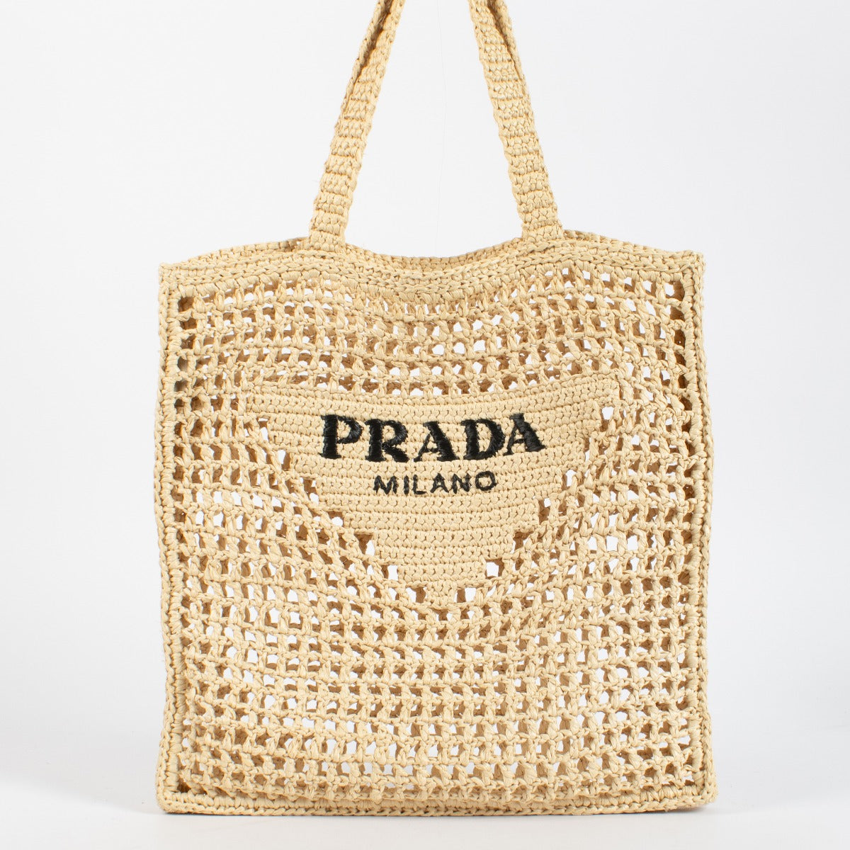 Prada Beige Raffia Tote with black embroidered logo. A lightweight, summery Prada design in excellent pre-loved condition.