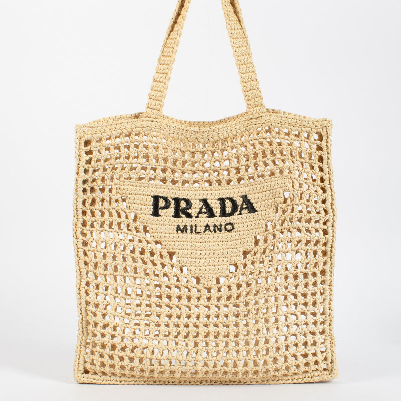 Prada Beige Raffia Tote with black embroidered logo. A lightweight, summery Prada design in excellent pre-loved condition.