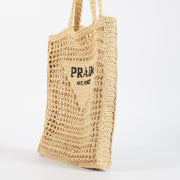 Prada Beige Raffia Tote with black embroidered logo. A lightweight, summery Prada design in excellent pre-loved condition.
