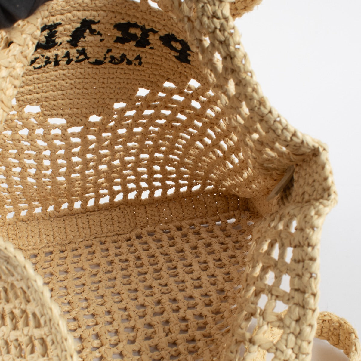 Prada Beige Raffia Tote with black embroidered logo. A lightweight, summery Prada design in excellent pre-loved condition.