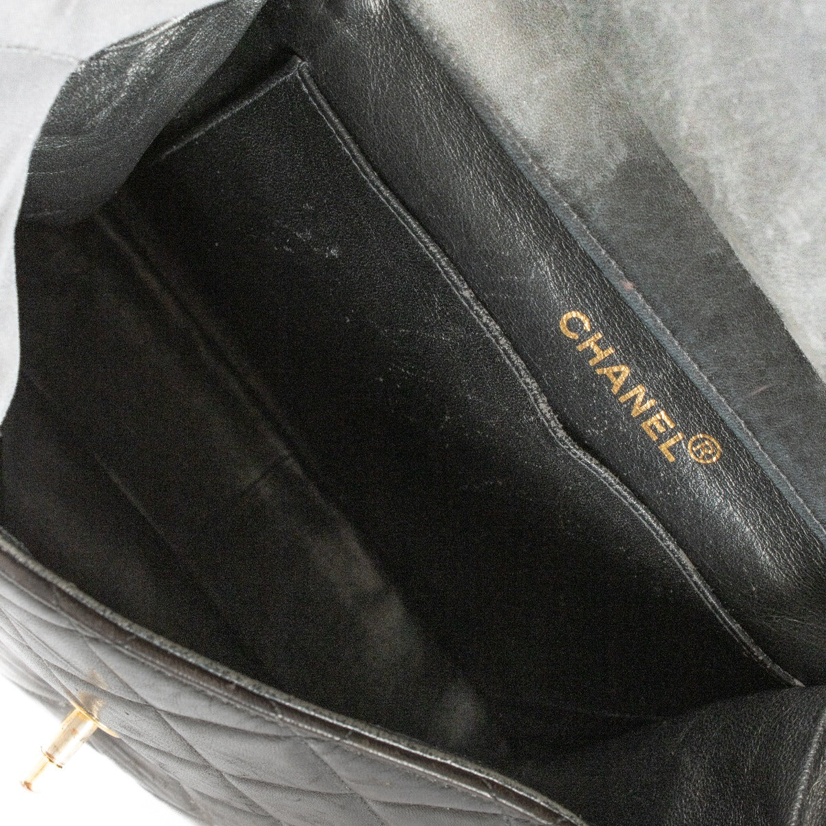 Shop safe online at Labellov in Antwerp, Brussels and Knokke this 100% authentic second hand Chanel Black Lambskin Double Sided Classic Flap Bag