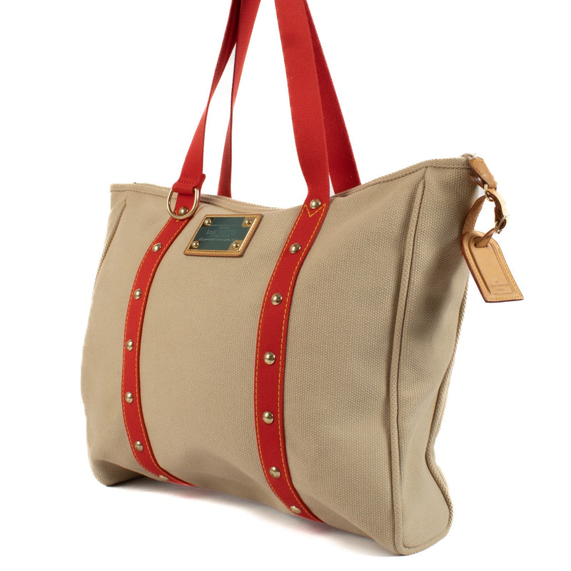 Louis Vuitton Red Beige Cloth Antigua Cabas GM Shoulder Bag for the best price at Labellov secondhand luxury in Antwerp, Brussels, Knokke.