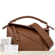 Authentic second hand brand new Loewe Tan Satin Calfskin Puzzle Bag at www.labellov.com