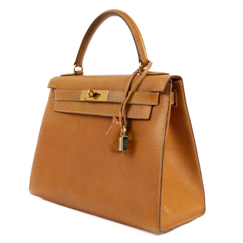 Authentic second hand luxury designer Hermès Vintage Kelly 28 Naturel Sable Peau Porc GHW on www.labellov.com