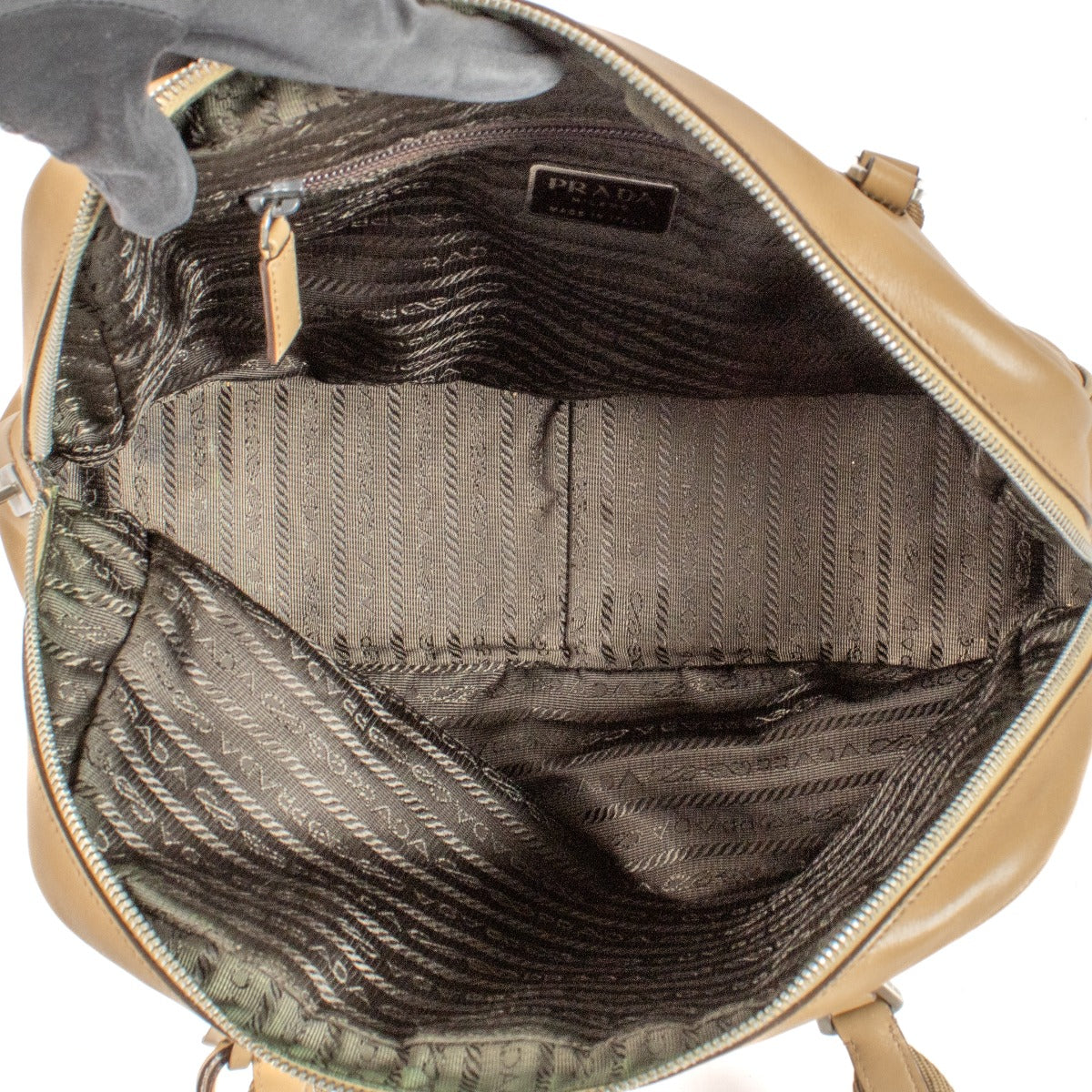 Shop safe online at Labellov in Antwerp and Knokke this 100% authentic second hand Prada Beige City Calf Bowling Bag