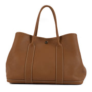 Shop safe online at Labellov in Antwerp, Brussels and Knokke this 100% authentic second hand Hermès Garden Party 36 Gold Togo PHW
