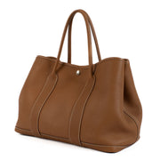 Shop safe online at Labellov in Antwerp, Brussels and Knokke this 100% authentic second hand Hermès Garden Party 36 Gold Togo