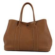 Shop safe online at Labellov in Antwerp, Brussels and Knokke this 100% authentic second hand Hermès Garden Party 36 Gold Togo