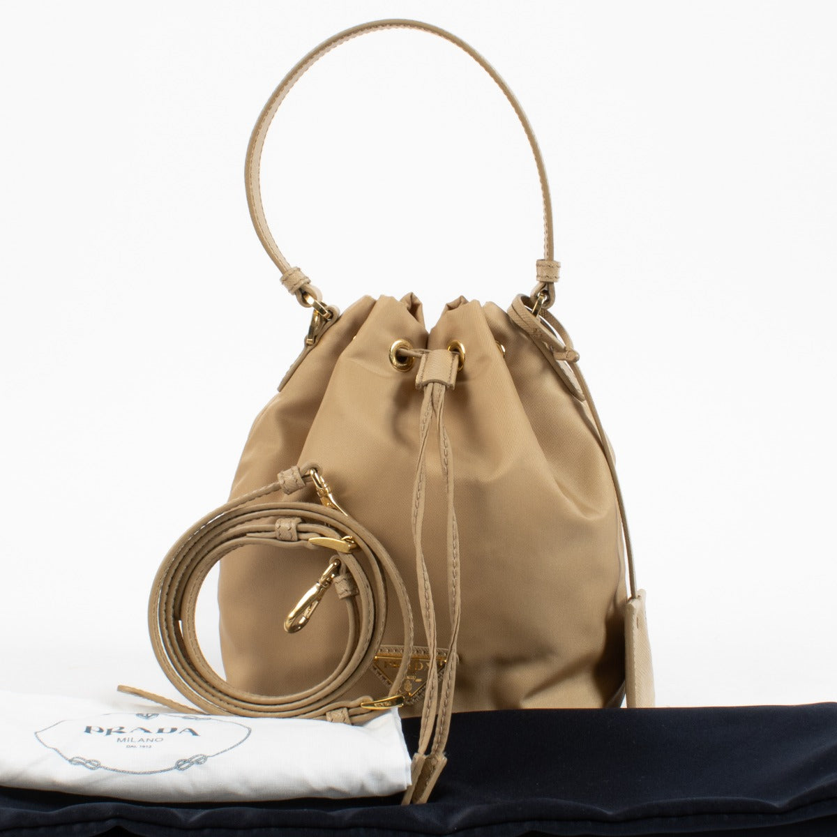 authentic preloved Prada Beige Re-Edition 1978 Bucket Bag on labellov.com