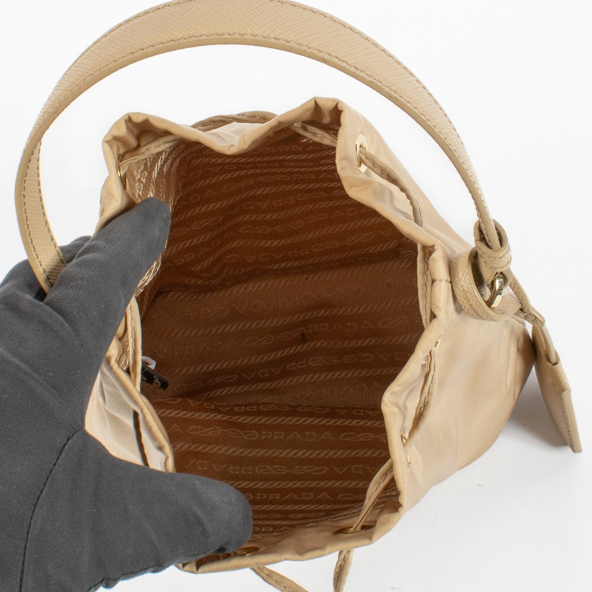 authentic preloved Prada Beige Re-Edition 1978 Bucket Bag on labellov.com