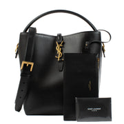 Elegant calfskin bucket bag with Cassandre closure, suede lining, and bronze-toned hardware. Shop at Labellov.