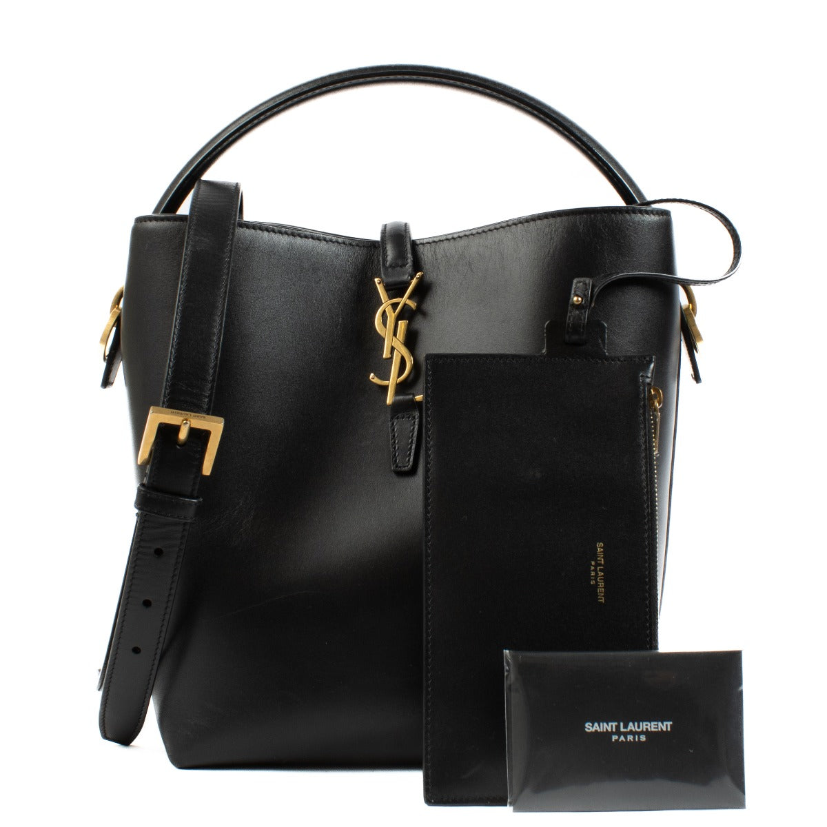 Elegant calfskin bucket bag with Cassandre closure, suede lining, and bronze-toned hardware. Shop at Labellov.