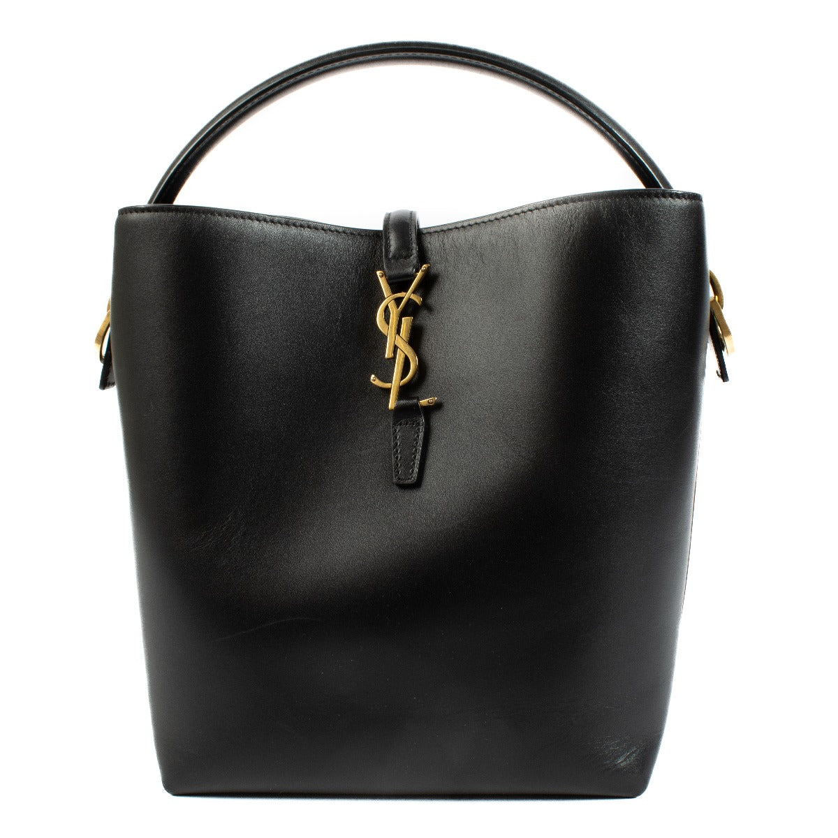 Elegant calfskin bucket bag with Cassandre closure, suede lining, and bronze-toned hardware. Shop at Labellov.