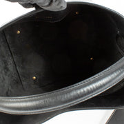 Elegant calfskin bucket bag with Cassandre closure, suede lining, and bronze-toned hardware. Shop at Labellov.