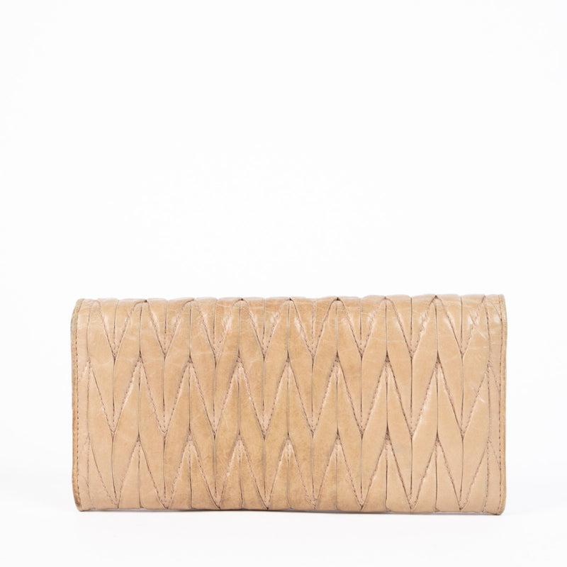 Authentic pre-loved Miu Miu Beige Matelassé Lux Flap Wallet on Labellov.com