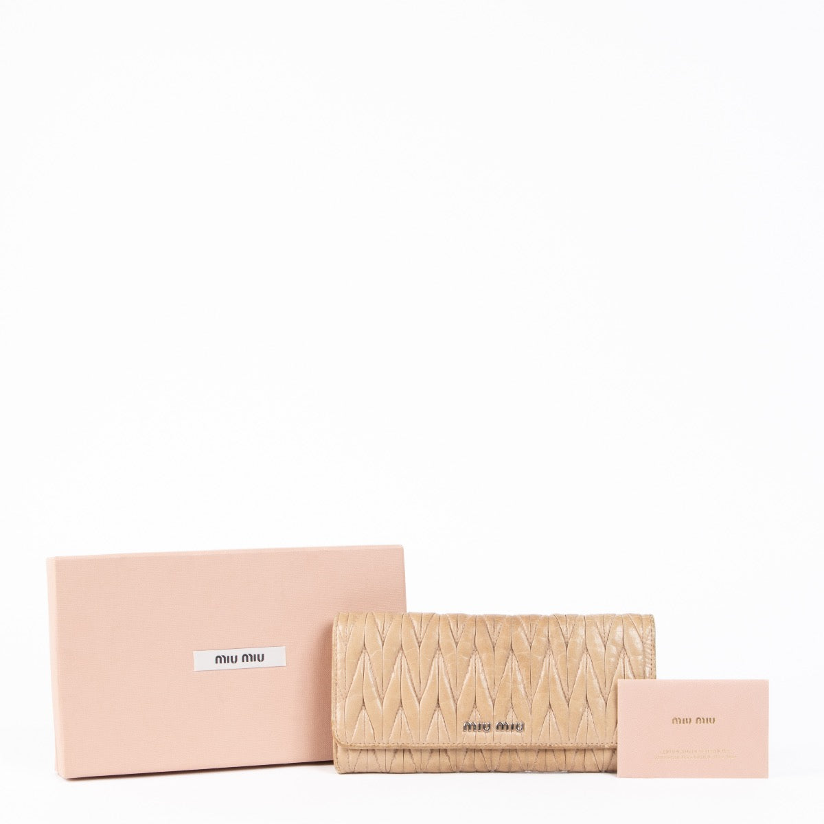 Authentic pre-loved Miu Miu Beige Matelassé Lux Flap Wallet on Labellov.com
