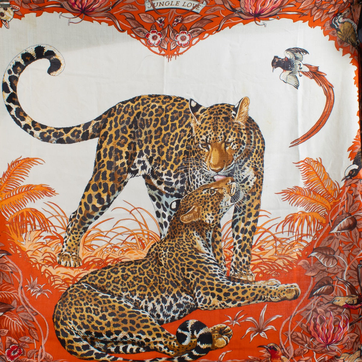 Shop safe online at Labellov in Antwerp, Brussels and Knokke this 100% authentic second hand Hermès Red Jungle Love 140 Cashmere Shawl
