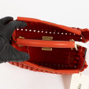 Shop safe online at Labellov in Antwerp, Brussels and Knokke this 100% authentic second hand Fendi Red Woven Leather Mini Peekaboo Bag